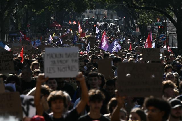 Protestors march along a street during a demonstration of high-school students as part of a nationwide protest movement over learning conditions in the south-western city of Bordeaux on October 6, 2026. Since late September, pupils have barred the entrances to hundreds of schools, complaining of teacher absences, overloaded timetables, dilapidated classrooms and buildings ill-adapted to rising temperatures, among other grievances. (Photo by Philippe LOPEZ / AFP)