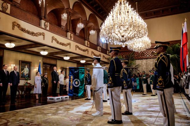Philippine President Ferdinand Marcos Jr (centre L) takes part in a welcome ceremony for Polish President Karol Nawrocki at Malacanang Palace in Manila on October 6, 2026. (Photo by Ezra Acayan / POOL / AFP)