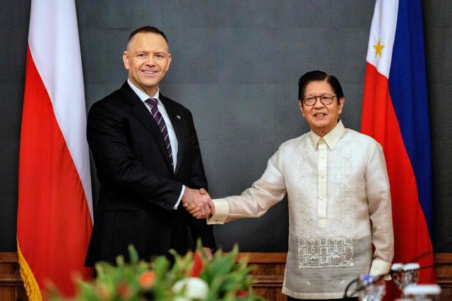 Philippines President Ferdinand Marcos Jr (R) shakes hands with Polish President Karol Nawrocki during a bilateral meeting at Malacanang Palace in Manila on October 6, 2026. (Photo by Ezra Acayan / POOL / AFP)