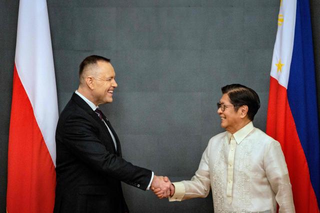 Philippines President Ferdinand Marcos Jr (R) shakes hands with Polish President Karol Nawrocki during a bilateral meeting at Malacanang Palace in Manila on October 6, 2026. (Photo by Ezra Acayan / POOL / AFP)