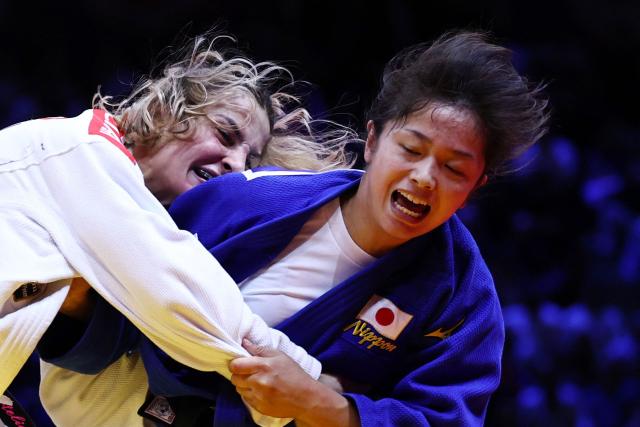 Georgia's Eteri Liparteliani (white) competes against Japan's Akari Omori in the women's under 57 kg category gold medal bout at the World Judo Championships in Baku on October 6, 2026. (Photo by Anne-Christine POUJOULAT / AFP)
