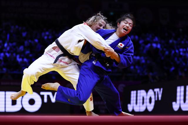 Georgia's Eteri Liparteliani (white) competes against Japan's Akari Omori in the women's under 57 kg category gold medal bout at the World Judo Championships in Baku on October 6, 2026. (Photo by Anne-Christine POUJOULAT / AFP)