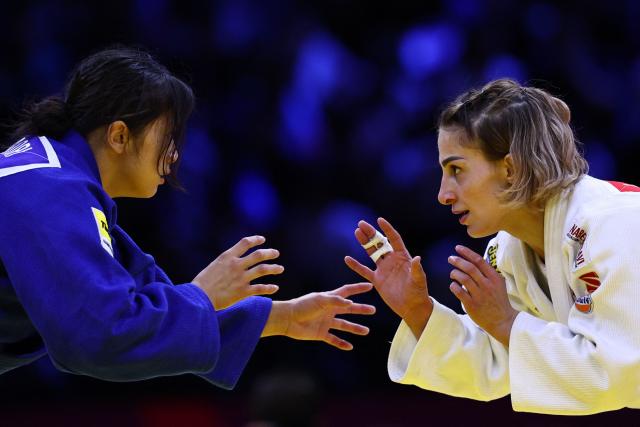 Georgia's Eteri Liparteliani (white) competes against Japan's Akari Omori in the women's under 57 kg category gold medal bout at the World Judo Championships in Baku on October 6, 2026. (Photo by Anne-Christine POUJOULAT / AFP)