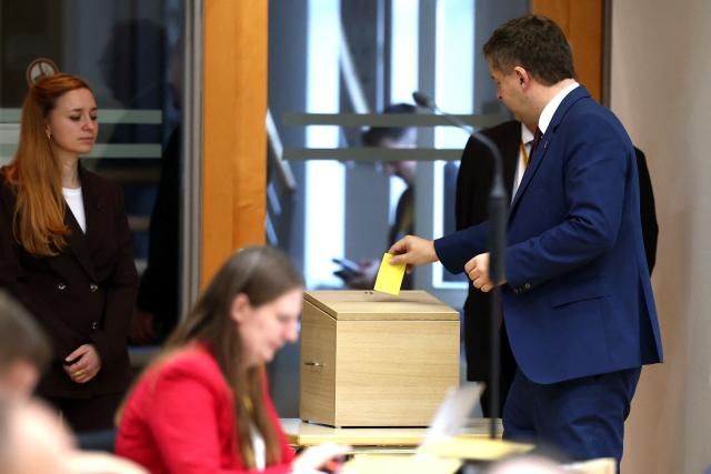 Sven Schulze, the CDU's regional leader and current state premier, casts his vote into an urn during the election for the vice-president of Saxony-Anhalt's state parliament during a session at the State Parliament in Magdeburg, eastern Germany on October 6, 2026, as the state parliament of Saxony-Anhalt convenes for the first time since the state elections. The AfD became Germany's first far-right party to win the post of speaker in a state parliament since World War II, when its candidate was elected in an eastern region. The Alternative for Germany (AfD) took nearly 44 percent of the September 2026 vote in Saxony Anhalt state in the former communist East Germany, easily beating the centre-right CDU of unpopular Chancellor Friedrich Merz. (Photo by Jan Woitas / POOL / AFP)