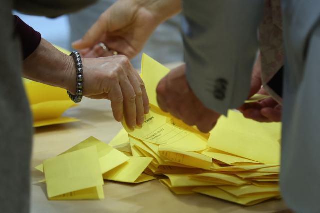 Ballots are counted, with one of them bearing the name of candidate and CDU politician Carsten Borchert, during the election for the vice-president of Saxony-Anhalt's state parliament during a session at the State Parliament in Magdeburg, eastern Germany on October 6, 2026, as the state parliament of Saxony-Anhalt convenes for the first time since the state elections. The AfD became Germany's first far-right party to win the post of speaker in a state parliament since World War II, when its candidate was elected in an eastern region. The Alternative for Germany (AfD) took nearly 44 percent of the September 2026 vote in Saxony Anhalt state in the former communist East Germany, easily beating the centre-right CDU of unpopular Chancellor Friedrich Merz. (Photo by Ronny HARTMANN / POOL / AFP)