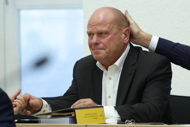 CDU politician Carsten Borchert, newly elected Deputy President of the State Parliament, is congratulated by CDU politician Marco Tullner (not pictured) during a session at the State Parliament in Magdeburg, eastern Germany on October 6, 2026, as the state parliament of Saxony-Anhalt convenes for the first time since the state elections. The AfD became Germany's first far-right party to win the post of speaker in a state parliament since World War II, when its candidate was elected in an eastern region. The Alternative for Germany (AfD) took nearly 44 percent of the September 2026 vote in Saxony Anhalt state in the former communist East Germany, easily beating the centre-right CDU of unpopular Chancellor Friedrich Merz. (Photo by Ronny HARTMANN / POOL / AFP)
