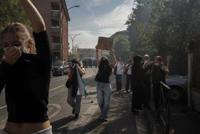 Protesters retreat from tear gas fired by riot police during a demonstration of high-school students as part of a nationwide protest movement over learning conditions in Toulouse, on October 6, 2026. Since late September, pupils have barred the entrances to hundreds of schools, complaining of teacher absences, overloaded timetables, dilapidated classrooms and buildings ill-adapted to rising temperatures, among other grievances. (Photo by Ed JONES / AFP)