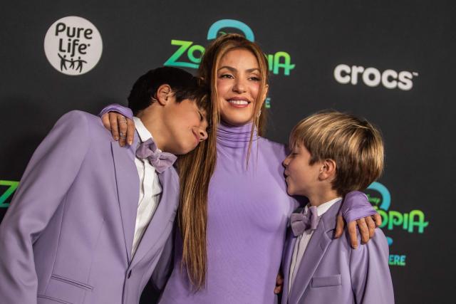 (FILES) Colombian singer-songwriter Shakira (C) and her sons Milan Pique Mebarak (L) and Sasha Pique Mebarak attend the world premiere of Walt Disney Animation Studios' "Zootopia 2" in Los Angeles, California, on November 13, 2025. Pop star Shakira and her former partner, retired Spanish footballer Gerard Pique, appeared at a Barcelona court on October 6, 2026 to review visitation arrangements for their two children, with the singer seeking changes to limit their travel between the US and Spain. (Photo by Apu GOMES / AFP)