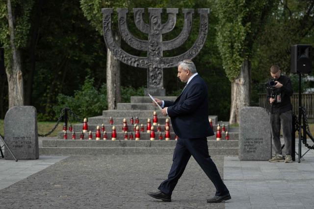 Member of the Knesset and minister in the Finance Ministry of Israel Ze’ev Elkin takes part in a memorial ceremony at the Babyn Yar National Historical and Memorial Reserve to honor the victims of the mass execution of civilians by the Nazis during World War II, in Kyiv on October 6, 2026, amid the Russian invasion of Ukraine. (Photo by Genya SAVILOV / AFP)