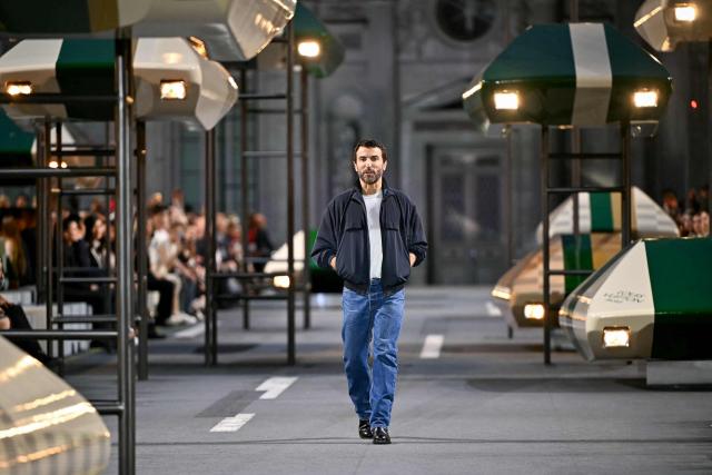 French-Belgian fashion designer Nicolas Ghesquiere aknowledges the audience at the end of the Louis Vuitton Women's Spring/Summer 2027 collection fashion show as part of the Paris Fashion Week, in Paris on October 6, 2026. (Photo by LOU BENOIST / AFP)