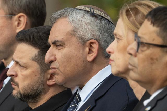 President of Ukraine Volodymyr Zelensky (L), Member of the Knesset and minister in the Finance Ministry of Israel Zeev Elkin (2L), Federal Minister of Education, Family, Senior Citizens, Women and Youth of Germany Karin Prien (2R) and Ambassador of Israel to Ukraine Roi Rosenblit (R) take part in a memorial ceremony at the Babyn Yar National Historical and Memorial Reserve to honor the victims of the mass execution of civilians by the Nazis during World War II, in Kyiv on October 6, 2026, amid the Russian invasion of Ukraine. (Photo by Genya SAVILOV / AFP)