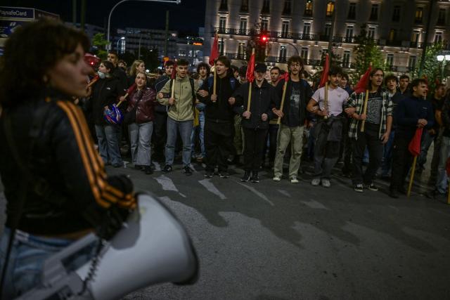 Protesters shout slogans outside the Greek Parliament during a demonstration against the official visit of US Secretary of State Marco Rubio to Athens, on October 6, 2026. More than 2,000 protesters, according to the police, gathered in central Athens on Tuesday evening to protest against the visit of U.S. Secretary of State Marco Rubio to Greece. (Photo by Aris MESSINIS / AFP)