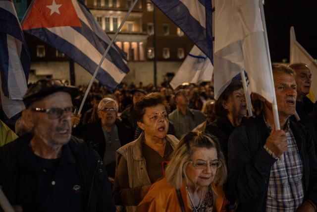 Protesters shout slogans outside the Greek Parliament during a demonstration against the official visit of US Secretary of State Marco Rubio to Athens, on October 6, 2026. More than 2,000 protesters, according to the police, gathered in central Athens on Tuesday evening to protest against the visit of U.S. Secretary of State Marco Rubio to Greece. (Photo by Angelos TZORTZINIS / AFP)