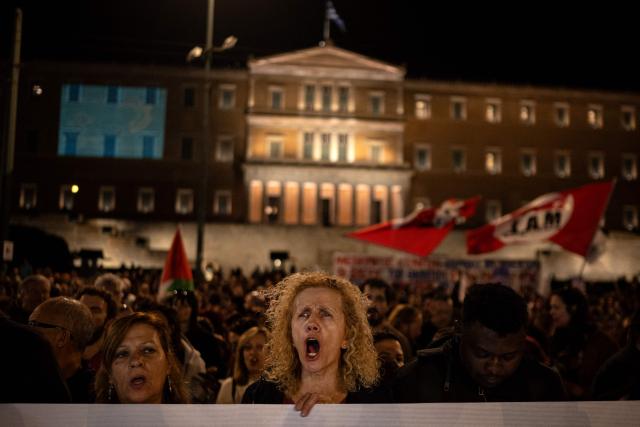 Protesters shout slogans outside the Greek Parliament during a demonstration against the official visit of US Secretary of State Marco Rubio to Athens, on October 6, 2026. More than 2,000 protesters, according to the police, gathered in central Athens on Tuesday evening to protest against the visit of U.S. Secretary of State Marco Rubio to Greece. (Photo by Angelos TZORTZINIS / AFP)