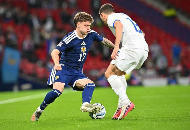 Slovenia's defender Erik Janza (R) vies with Scotland's midfielder #17 Ben Gannon-Doak during the UEFA Nations League, League B, Group 1 football match between Scotland and Slovenia at Hampden Park in Glasgow, Scotland on October 6, 2026.  (Photo by ANDY BUCHANAN / AFP)