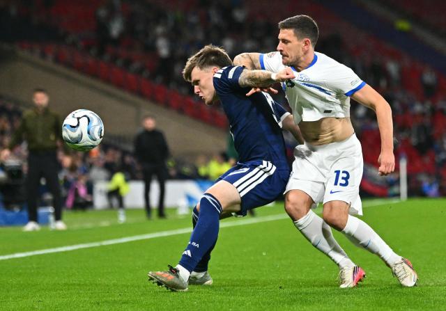 Slovenia's defender Erik Janza (R) vies with Scotland's midfielder #17 Ben Gannon-Doak during the UEFA Nations League, League B, Group 1 football match between Scotland and Slovenia at Hampden Park in Glasgow, Scotland on October 6, 2026.  (Photo by ANDY BUCHANAN / AFP)