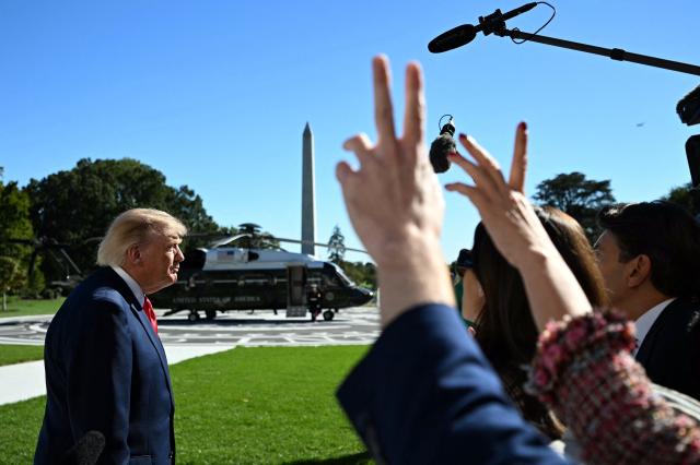 US President Donald Trump speaks to the press before walking to board Marine One on the South Lawn of the White House in Washington, DC, on October 6, 2026. President Trump is traveling to Sparrows Point, Maryland where he will speak at Anduril Industries. (Photo by Alex WROBLEWSKI / AFP)