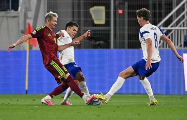 Finland's midfielder #10 Leo Walta (C) and Finland's midfielder #08 Onni Valakari (R) vie for the ball with Belarus' midfielder #08 Aleksandr Selyava during the UEFA Nations League Group C1 football match between Belarus and Finland in Budapest, Hungary on October 6, 2026. (Photo by Attila KISBENEDEK / AFP)