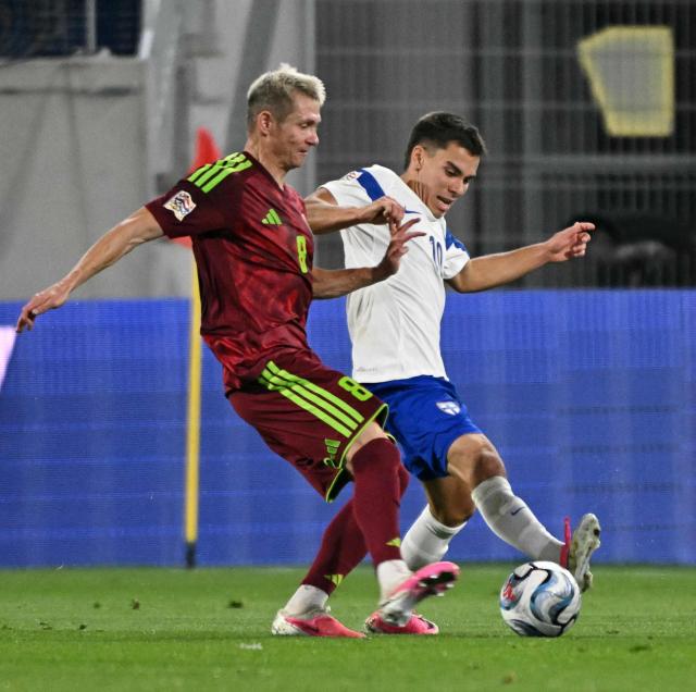 Finland's midfielder #10 Leo Walta (R) vies for the ball with Belarus' midfielder #08 Aleksandr Selyava during the UEFA Nations League Group C1 football match between Belarus and Finland in Budapest, Hungary on October 6, 2026. (Photo by Attila KISBENEDEK / AFP)