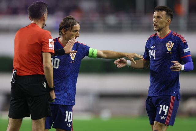 Croatia's midfielder #10 Luka Modric (C) and Croatia's midfielder #14 Ivan Perisic (R) speak with the referee during the UEFA Nations League Group A3 football match between Croatia and Spain at the Poljud stadium in Split on October 6, 2026. (Photo by MARKO PERKOV / AFP)
