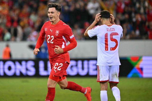 Switzerland's midfielder #22 Fabian Rieder (L) celebrates after scoring Switzerland's first goal during the UEFA Nations League Group B1 football match between Switzerland and North Macedonia at the Thermoplan Arena in Lucerne on October 6, 2026. (Photo by Fabrice COFFRINI / AFP)