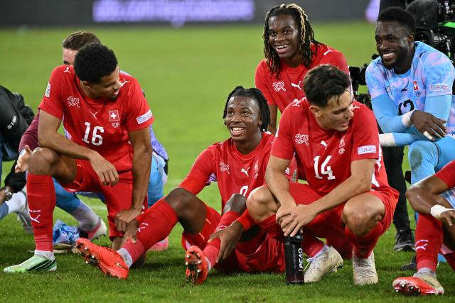 (From L to R) Switzerland's defender #16 Zachary Athekame, Switzerland's midfielder #9 Johan Manzambi, Switzerland's forward #19 Winsley Boteli, Switzerland's midfielder #14 Ardon Jashari and Switzerland's goalkeeper #12 Yvon Mvogo celebrate their team's victory at the end of the UEFA Nations League Group B1 football match between Switzerland and North Macedonia at the Thermoplan Arena in Lucerne on October 6, 2026. (Photo by Fabrice COFFRINI / AFP)