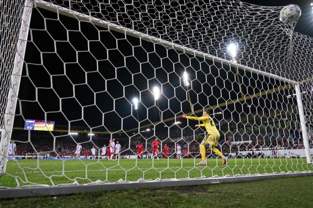 North Macedonia's goalkeeper #23 Stole Dimitrievski (R) watches as the ball hits the back of the net as Switzerland's midfielder #9 Johan Manzambi scores Switzerland's second goal during the UEFA Nations League Group B1 football match between Switzerland and North Macedonia at the Thermoplan Arena in Lucerne on October 6, 2026. (Photo by Fabrice COFFRINI / AFP)