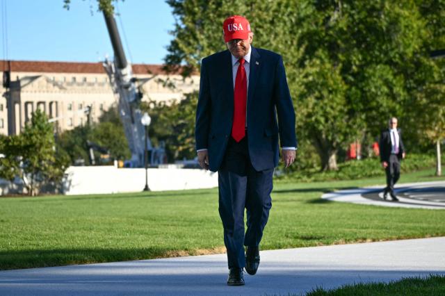 US President Donald Trump walks to speak to the press upon his return to the White House in Washington, DC, on October 6, 2026. President Trump is returning from Sparrows Point, Maryland, where he spoke at Anduril Industries. (Photo by Alex WROBLEWSKI / AFP)