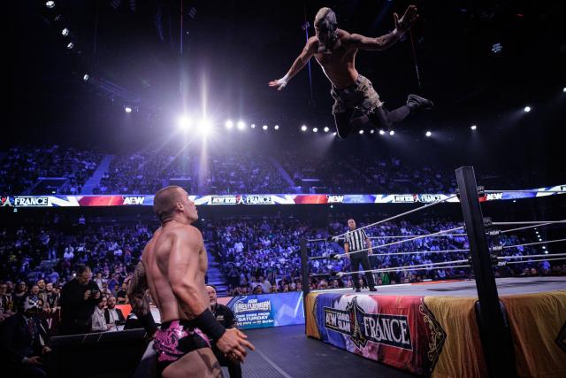Wrestler Darby Allin (R) jumps on wrestler Kyle Fletcher (L) at the AEW Grand Slam event at the Adidas Arena in Paris on October 6, 2026. (Photo by Simon WOHLFAHRT / AFP)
