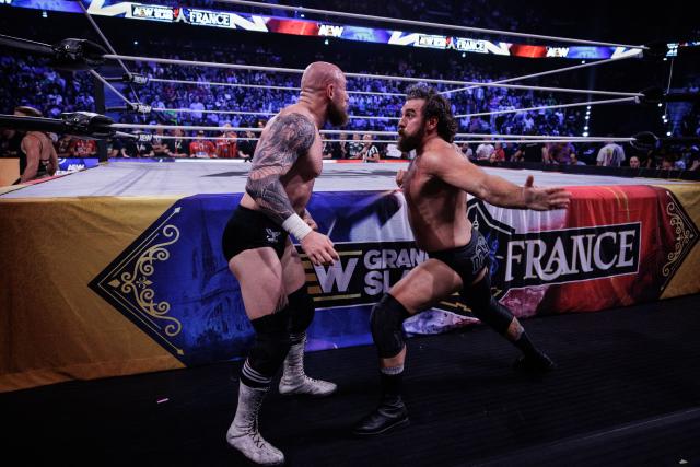 Wrestler Doyle (R) and wrestler Jon Moxley perform (L) fight during the AEW Grand Slam event at the Adidas Arena in Paris on October 6, 2026. (Photo by Simon WOHLFAHRT / AFP)