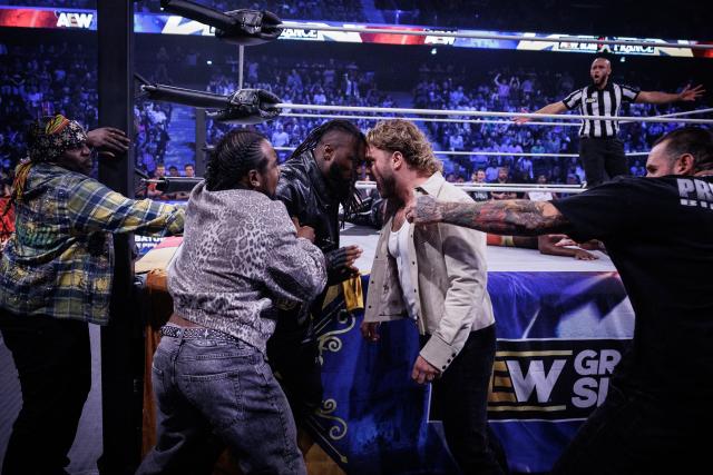 Wrestlers start arguing while being held apart by others during the AEW Grand Slam event at the Adidas Arena in Paris on October 6, 2026. (Photo by Simon WOHLFAHRT / AFP)
