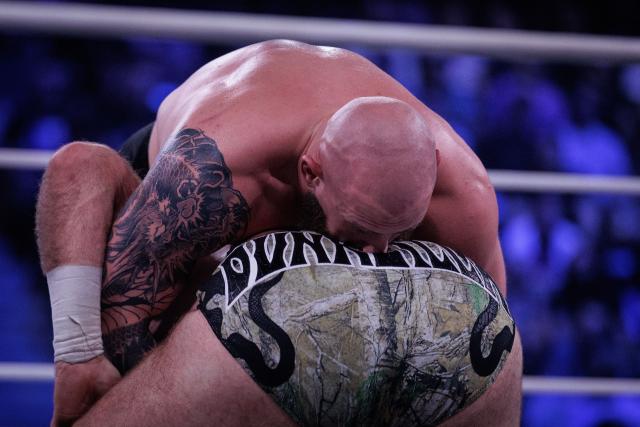 Wrestler Gabe Kidd (up) and wrestler Davis (bottom) perform during the AEW Grand Slam event at the Adidas Arena in Paris on October 6, 2026. (Photo by Simon WOHLFAHRT / AFP)