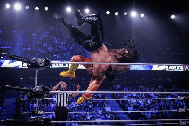 Wrestlers Bandido (C) and Kofi (R) perform during the AEW Grand Slam event at the Adidas Arena in Paris on October 6, 2026. (Photo by Simon WOHLFAHRT / AFP)