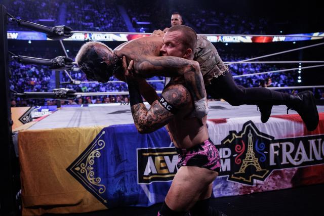 Wrestlers Darby Allin (L) and Kyle Fletcher (R) perform during the AEW Grand Slam event at the Adidas Arena in Paris on October 6, 2026. (Photo by Simon WOHLFAHRT / AFP)