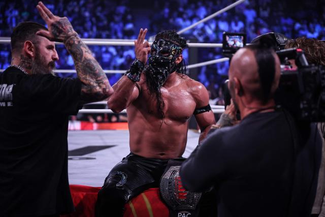 Wrestlers Bandido (C) celebrates winning his fight during the AEW Grand Slam event at the Adidas Arena in Paris on October 6, 2026. (Photo by Simon WOHLFAHRT / AFP)