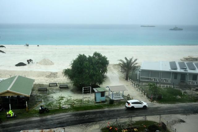 This picture taken on October 6, 2026 shows an aerial view of a land reclamation project in Tuvalu on a cloudy day. The low-lying Pacific island nation is widely regarded as one of the countries most vulnerable to climate change and rising sea levels, which threaten its land, infrastructure and freshwater resources. (Photo by Saeed KHAN / AFP)