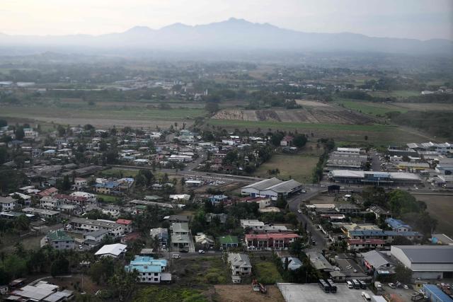 This picture taken on October 6, 2026 shows an aerial view of Nadi, Fiji on a cloudy day. Like many coastal communities across the Pacific, Fiji faces increasing risks from climate change, including rising sea levels and more frequent extreme weather events. (Photo by Saeed KHAN / AFP)