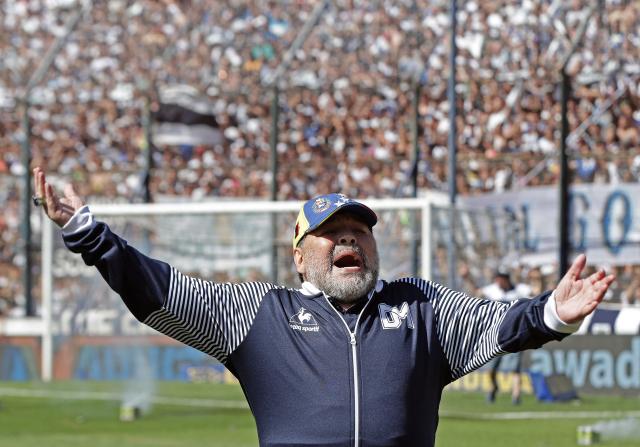 (FILES) Argentina's Gimnasia y Esgrima La Plata coach, former football star Diego Armando Maradona gestures during their Argentina First Division Superliga football match against Estudiantes, at El Bosque stadium, in La Plata city, Buenos Aires province, Argentina, on November 2, 2019. The trial over Diego Maradona's death enters its final stage in early October 2026 after almost six months of hearings, with the question still unresolved as to whether the football icon's death in late 2020 was unforeseeable or the result of medical negligence during his home care. (Photo by ALEJANDRO PAGNI / AFP)