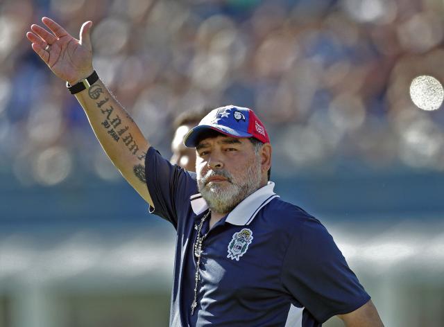 (FILES) Argentina's Gimnasia y Esgrima La Plata coach, former football star Diego Armando Maradona waves to supporters during an Argentina First Division Superliga football match against Estudiantes, at El Bosque stadium, in La Plata, Buenos Aires province, Argentina, on November 2, 2019. The trial over Diego Maradona's death enters its final stage in early October 2026 after almost six months of hearings, with the question still unresolved as to whether the football icon's death in late 2020 was unforeseeable or the result of medical negligence during his home care. (Photo by ALEJANDRO PAGNI / AFP)