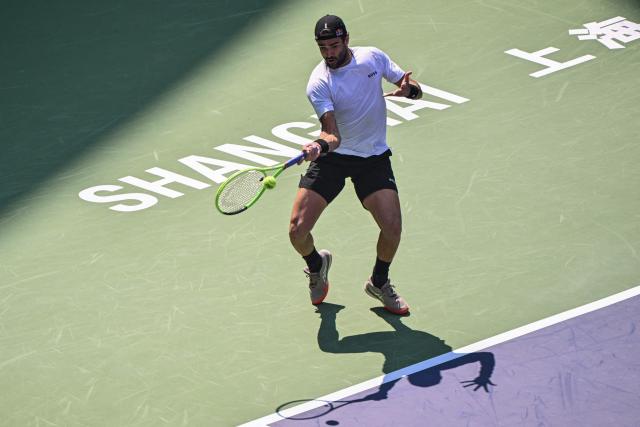 Italy's Matteo Berrettini hits a return to USA's Aleksandar Kovacevic during their men's singles match at the Shanghai Masters tennis tournament in Shanghai on October 7, 2026. (Photo by Hector RETAMAL / AFP)