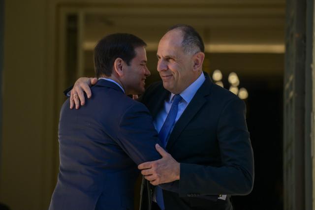 US Secretary of State Marco Rubio (L) is welcomed by Greek Foreign Minister George Gerapetritis (R) prior to their meeting at the Ministry of Foreign Affairs in Athens on October 7, 2026. (Photo by Aris MESSINIS / AFP)