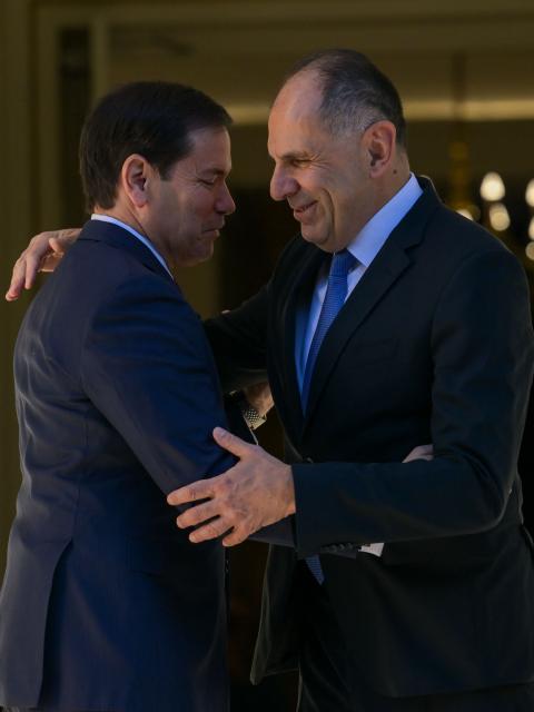 US Secretary of State Marco Rubio (L) is welcomed by Greek Foreign Minister George Gerapetritis (R) prior to their meeting at the Ministry of Foreign Affairs in Athens on October 7, 2026. (Photo by Aris MESSINIS / AFP)