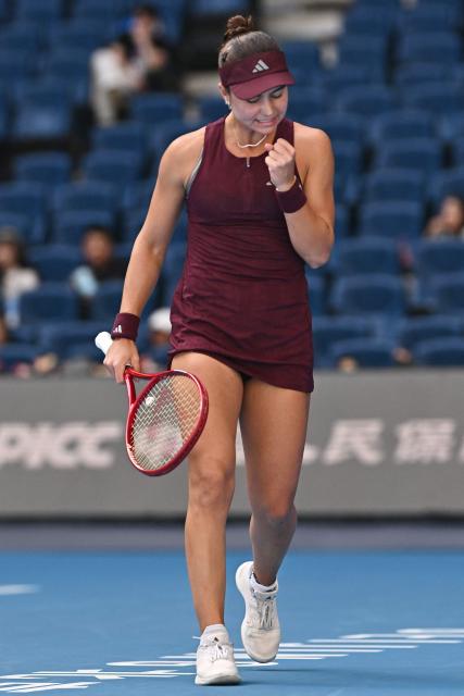 USA's Iva Jovic reacts during her women's singles match against Poland's Iga Swiatek at the China Open tennis tournament in Beijing on October 7, 2026. (Photo by Pedro PARDO / AFP)