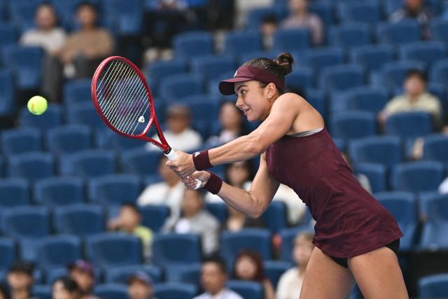 USA's Iva Jovic hits a return to Poland's Iga Swiatek during their women's singles match at the China Open tennis tournament in Beijing on October 7, 2026. (Photo by Pedro PARDO / AFP)