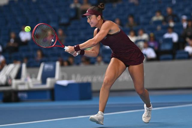 USA's Iva Jovic hits a return to Poland's Iga Swiatek during their women's singles match at the China Open tennis tournament in Beijing on October 7, 2026. (Photo by Pedro PARDO / AFP)