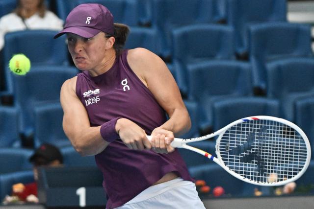 Poland's Iga Swiatek hits a return to USA's Iva Jovic during their women's singles match at the China Open tennis tournament in Beijing on October 7, 2026. (Photo by Pedro PARDO / AFP)