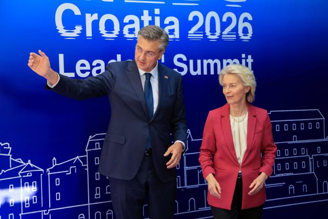 Croatia's Prime Minister Andrej Plenkovic (L) officially welcomes European Commission President Ursula von der Leyen during the MED9 summit in Split on October 7, 2026, where the leaders of nine EU nations and invited leaders are gathering. (Photo by Ludovic MARIN / AFP)