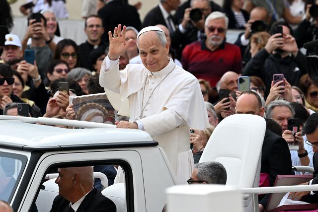 Pope Leo XIV waves to the crowd from the popemobile as he arrives for the weekly general audience at St Peter's Square, in the Vatican, on October 7, 2026. (Photo by Andreas SOLARO / AFP)