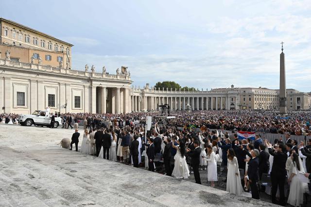 Pope Leo XIV waves to the crowd from the popemobile as he arrives for the weekly general audience at St Peter's Square, in the Vatican, on October 7, 2026. (Photo by Andreas SOLARO / AFP)