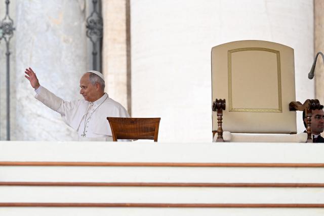 Pope Leo XIV waves to the crowd at the start of his weekly general audience at St Peter's Square in the Vatican on October 7, 2026. (Photo by Andreas SOLARO / AFP)